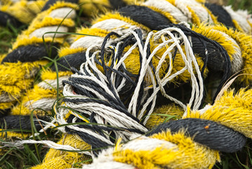 Black and yellow fishing nets and ropes 