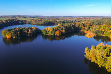 Naklejka na ściany i meble Aerial landscape of the lake in autumn, Poland