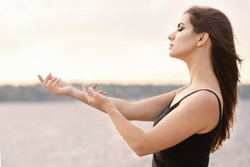 Portrait of beautiful young woman outdoors