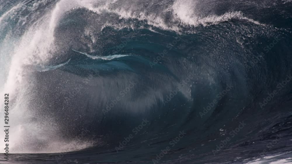 Aufkleber a close look at the inside of a heavy wave as it breaks along a shallow rock shelf in slow motion.