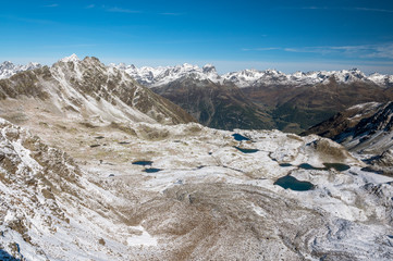 Macun Lakes in autumn with the first snow