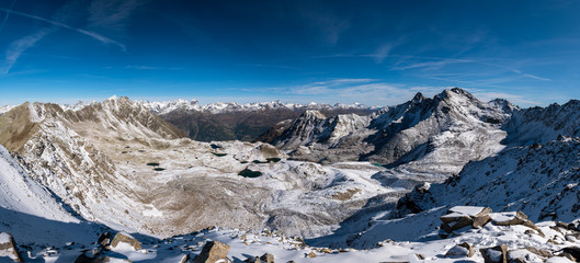 panoramic view over Macun Lakes in autumn with the first snow