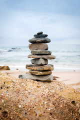 Fototapeta na wymiar Stack of stones on the beach, Tarifa, Cadiz, Andalucia, Spain