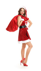 Beautiful woman dressed as Santa with bag on white background