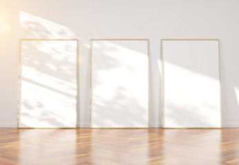 Three wooden frame leaning in wooden interior mockup 3D rendering