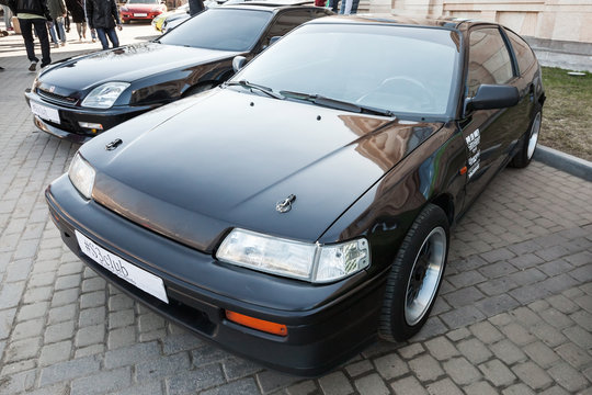 Black sporty classical Honda Civic CRX stands