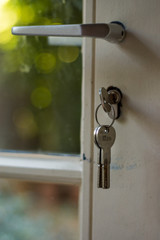 A key hanging in a key hole