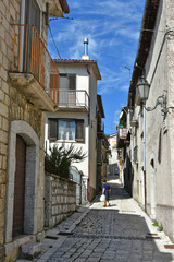 Province of Benevento, Italy, 09/15/2018. A road among the old houses of a mountain village.