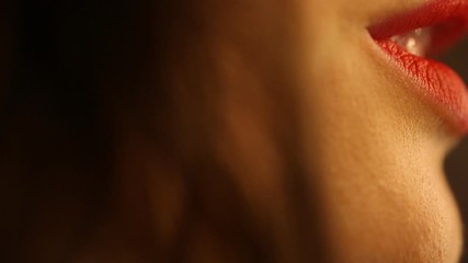 Woman applying red lipstick