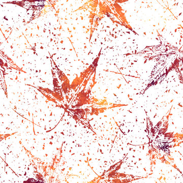 Colorful vector seamless pattern with a maple leaves stamps. Autumn natural grunge background.