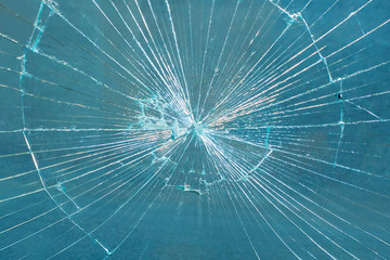 Broken Glass Pane. Smashed Blue Glass