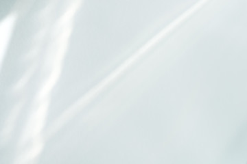 White background from sunlight rays through wall