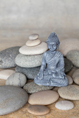 Buddha Statue And Balanced Stone Cairn