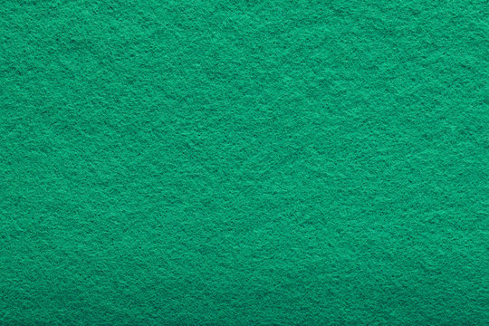 shaggy surface. Fine grain felt green fabric. artificial grass. fleecy texture background.