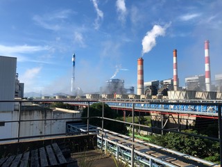 Fototapeta premium industrial factory with smoking chimneys