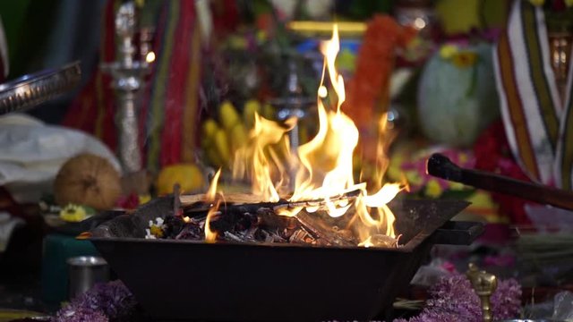 Agni kund which is a traditional fire pit of Indian culture is being used in an occasion .