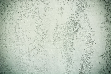 Light green or grey grungy concrete wall texture. Stone surface pattern.