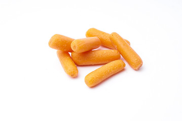 Raw Organic Orange Baby Carrots on black bowl, isolated white background