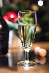 filled wine glass in a Christmas decoration