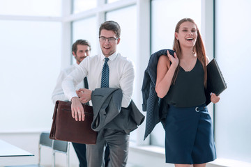 young employees completing their work in the office