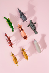 animals plastic figurine pink background
