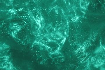 Abstract holiday mint glitter magic shimmering luxury background. Festive sparkles and lights....