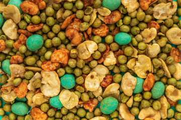 Background of Japanese corn snacks with peanuts and wasabii