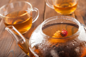 Ceylon tea in a teapot and mug closeup. Leafy beautiful tea copy space. Autumn, comfort, tea, warmth, concept.