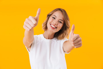 Image of attractive blond woman smiling and showing thumbs up
