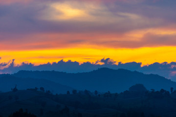 Beautiful sunrise over the mountain range at the west of thailand, nature landscape twilight background .