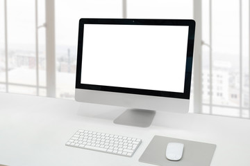 Computer display on office desk with isolated screen for mockup, design or product presentation.