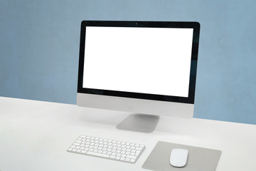 Computer display mockup. Clean office desk with computer display, mouse and keyboard. Isoalted screen for mockup, design presentation.