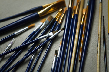 Artist oil Paint Brushes closeup on artistic canvas