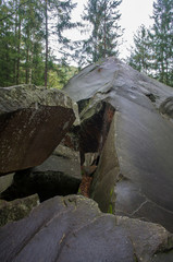 Obraz premium Scandinavian mountain nature with stones. Rocks in the forest with moss.