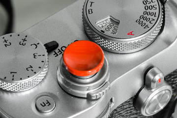 silver color camera shutter button and dial closeup view