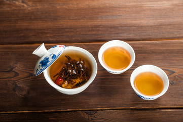 Ceylon tea in a teapot and mug closeup. Leafy beautiful tea copy space. Autumn, comfort, tea, warmth, concept.