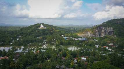 Fototapeta na wymiar View of Load Buddha Statue built on a mountain in urban Sri Lanka