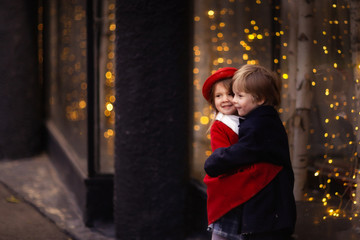 girl hugs and consoles boy, christmas story