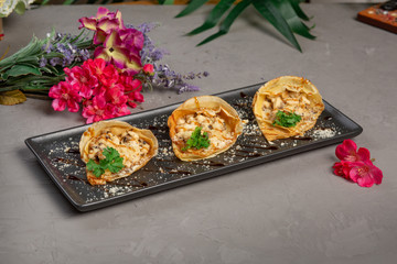 pancakes stuffed with julienne and decorated with greens