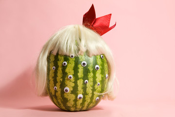 Freak watermelon wearing a wig