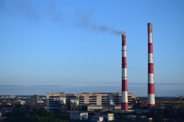 smoke from chimney on background of blue sky