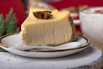 Slice of sweet cheesecake for Christmas Eve. Breakfast concept. Coffee time. Still life of food.