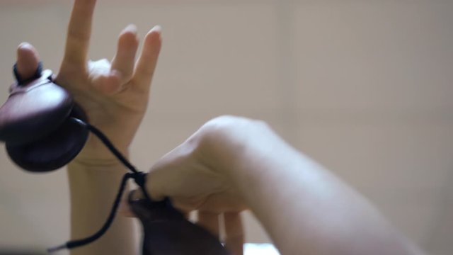 Spanish castanets in hands, girl dancing flamenco