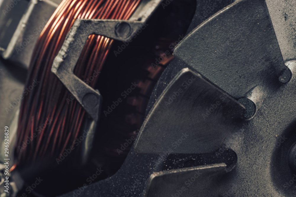 Poster close up old electric motor impeller on a dark background. macro view.