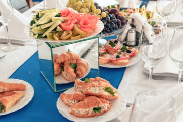 Catering service. Catering food. Table with food at event. Beautifully decorated catering banquet table with different food snacks and appetizers with sandwich.