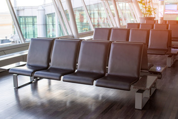 Seat in the airport interior in asia,Empty airport terminal waiting area with chairs.