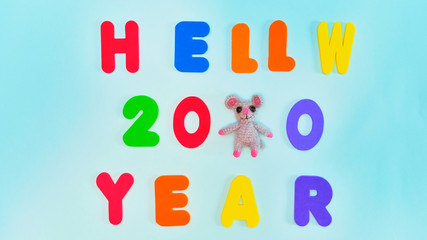 Text, Hello new year 2020, in multicolored letters on a blue background. New year greetings