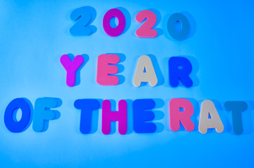 Text from collected multicolored letters on a light background.  text 2020 year or the rat
