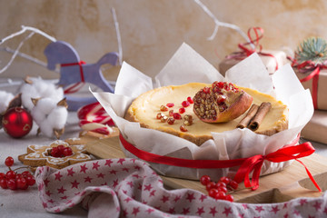 Festive Christmas cheesecake traditional winter cake recipe . Cheese cake whole with red ribbon