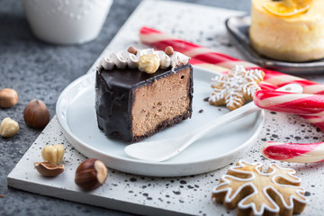  Christmas chocolate cake or cheesecake  on plate. Close up. Holiday food.